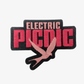 An embroidered patch from the EP 2026 Click & Collect Click & Collect Patch Set, featuring “ELECTRIC PICNIC” in bold pink and black letters, with a pink bird silhouette flying below the text.