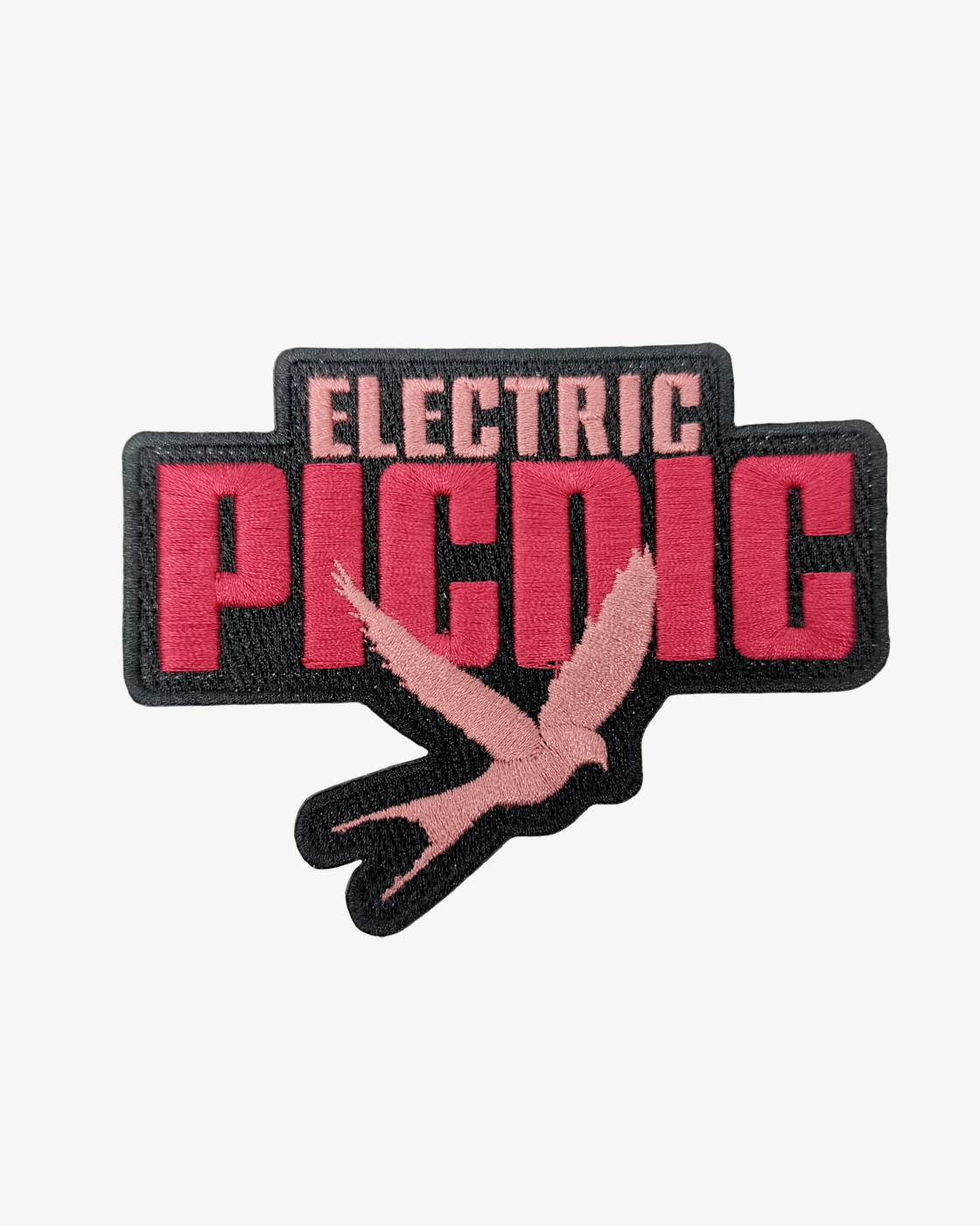 An embroidered patch from the EP 2026 Click & Collect Click & Collect Patch Set, featuring “ELECTRIC PICNIC” in bold pink and black letters, with a pink bird silhouette flying below the text.