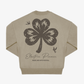 The Click & Collect Vintage Clover Crewneck Natural by EP 2026 Click & Collect features a large, distressed black shamrock graphic with two small birds, and "Electric Picnic Music and Arts Festival" printed on the back.
